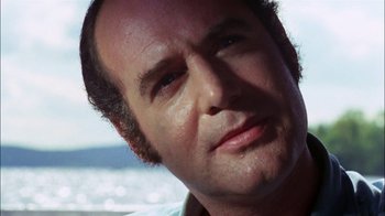Movie still from “Let's Scare Jessica to Death” (1971), directed by John D. Hancock – A man's face in front of the ocean; Close Up shot, Low angle