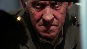 Movie still from “Let's Scare Jessica to Death” (1971), directed by John D. Hancock – An old man with a beard and a hat; Extreme Close Up shot, Low angle