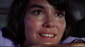 Movie still from “Let's Scare Jessica to Death” (1971), directed by John D. Hancock – A woman's face with brown eyes; Close Up shot, Low angle