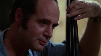Movie still from “Let's Scare Jessica to Death” (1971), directed by John D. Hancock – A person holding a cello; Close Up shot, Over the shoulder angle