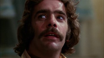 Movie still from “Let's Scare Jessica to Death” (1971), directed by John D. Hancock – A person with a mustache; Close Up shot, Low angle