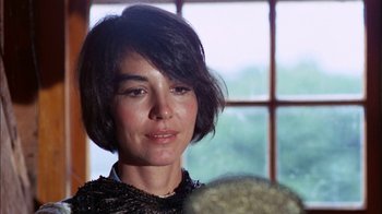 Movie still from “Let's Scare Jessica to Death” (1971), directed by John D. Hancock – A person wearing a black shirt; Close Up shot, Low angle