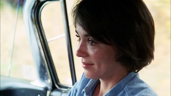 Movie still from “Let's Scare Jessica to Death” (1971), directed by John D. Hancock – A person sitting in a vehicle; Close Up shot, Over the shoulder angle