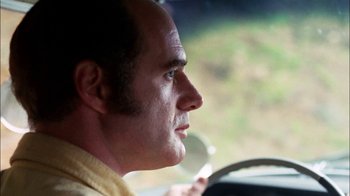 Movie still from “Let's Scare Jessica to Death” (1971), directed by John D. Hancock – A person driving a car; Close Up shot, Low angle