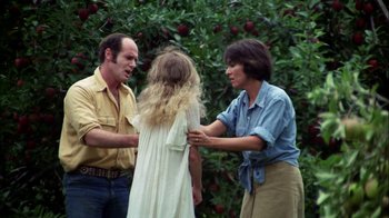 Movie still from “Let's Scare Jessica to Death” (1971), directed by John D. Hancock – Two women and a man standing next to each other in front of a tree; Medium shot, Over the shoulder angle