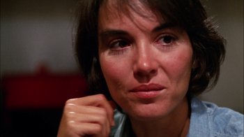 Movie still from “Let's Scare Jessica to Death” (1971), directed by John D. Hancock – A person with a hand on her chin; Close Up shot, Over the shoulder angle