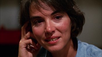 Movie still from “Let's Scare Jessica to Death” (1971), directed by John D. Hancock – A woman's face while holding a cell phone to her ear; Close Up shot, Over the shoulder angle