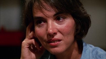 Movie still from “Let's Scare Jessica to Death” (1971), directed by John D. Hancock – A woman's face while holding a cell phone to her ear; Close Up shot, High angle