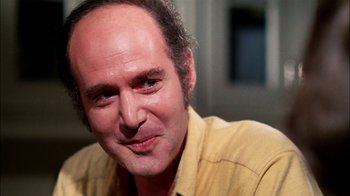 Movie still from “Let's Scare Jessica to Death” (1971), directed by John D. Hancock – A person wearing a yellow shirt; Close Up shot, Low angle