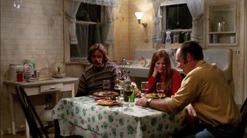 Movie still from “Let's Scare Jessica to Death” (1971), directed by John D. Hancock – A group of people sitting at a table with food on it; Wide shot, High angle