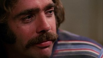 Movie still from “Let's Scare Jessica to Death” (1971), directed by John D. Hancock – A person with a mustache; Close Up shot, Low angle