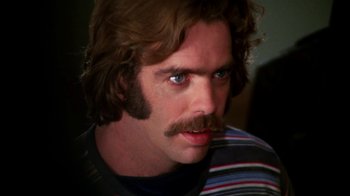 Movie still from “Let's Scare Jessica to Death” (1971), directed by John D. Hancock – A person with a mustache; Close Up shot, High angle