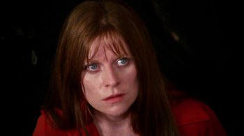 Movie still from “Let's Scare Jessica to Death” (1971), directed by John D. Hancock – A person with long brown hair; Close Up shot, High angle