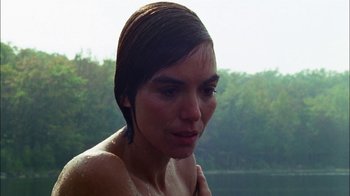 Movie still from “Let's Scare Jessica to Death” (1971), directed by John D. Hancock – A woman with wet hair is standing in the water; Close Up shot, Over the shoulder angle