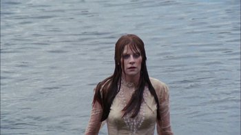 Movie still from “Let's Scare Jessica to Death” (1971), directed by John D. Hancock – A woman standing in the middle of a body of water; Medium shot, Low angle