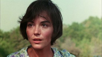Movie still from “Let's Scare Jessica to Death” (1971), directed by John D. Hancock – A person with short black hair; Close Up shot, Over the shoulder angle