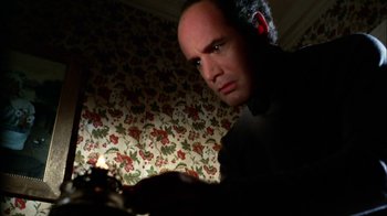 Movie still from “Let's Scare Jessica to Death” (1971), directed by John D. Hancock – A man in a black shirt is looking at the camera; Close Up shot, Low angle