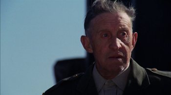 Movie still from “Let's Scare Jessica to Death” (1971), directed by John D. Hancock – An old man with a military jacket on looking into the distance; Close Up shot, Low angle