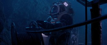 Movie still from “Leviathan” (1989), directed by George P. Cosmatos – A man in a scuba suit in the water; Wide shot, High angle