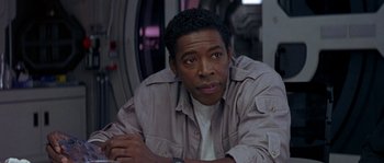 Movie still from “Leviathan” (1989), directed by George P. Cosmatos – A person wearing a jacket; Close Up shot, Over the shoulder angle