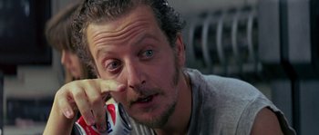 Movie still from “Leviathan” (1989), directed by George P. Cosmatos – A person holding a can of soda; Close Up shot, Over the shoulder angle