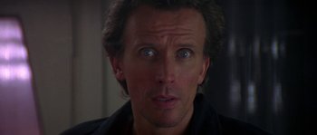 Movie still from “Leviathan” (1989), directed by George P. Cosmatos – A person with blue eyes; Close Up shot, Low angle