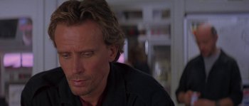 Movie still from “Leviathan” (1989), directed by George P. Cosmatos – A person with long hair; Close Up shot, Over the shoulder angle