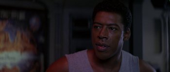 Movie still from “Leviathan” (1989), directed by George P. Cosmatos – A person with a cell phone; Close Up shot, Low angle