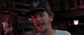 Movie still from “Leviathan” (1989), directed by George P. Cosmatos – A person wearing a hat; Close Up shot, High angle