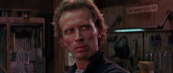 Movie still from “Leviathan” (1989), directed by George P. Cosmatos – A person with long hair; Close Up shot, Low angle