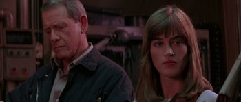 Movie still from “Leviathan” (1989), directed by George P. Cosmatos – A man and a woman sitting next to each other; Close Up shot, Over the shoulder angle