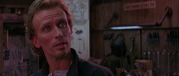 Movie still from “Leviathan” (1989), directed by George P. Cosmatos – A person wearing a jacket; Close Up shot, Over the shoulder angle