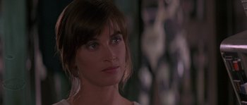 Movie still from “Leviathan” (1989), directed by George P. Cosmatos – A woman's face in front of a mirror; Close Up shot, Over the shoulder angle