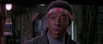 Movie still from “Leviathan” (1989), directed by George P. Cosmatos – A person wearing a head band; Close Up shot, Low angle