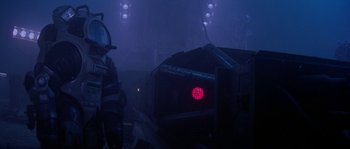 Movie still from “Leviathan” (1989), directed by George P. Cosmatos – A red light in the middle of a dark room; Medium shot, Low angle