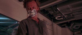 Movie still from “Leviathan” (1989), directed by George P. Cosmatos – A man with a duct taped to his mouth; Close Up shot, Low angle