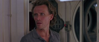 Movie still from “Leviathan” (1989), directed by George P. Cosmatos – A person with long hair; Close Up shot, Low angle