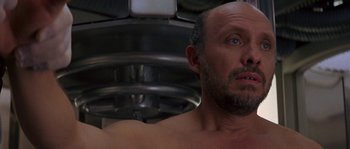 Movie still from “Leviathan” (1989), directed by George P. Cosmatos – A man with a beard is looking at the camera; Close Up shot, Low angle