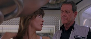 Movie still from “Leviathan” (1989), directed by George P. Cosmatos – A man and a woman looking at one another; Close Up shot, Over the shoulder angle