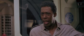 Movie still from “Leviathan” (1989), directed by George P. Cosmatos – A person wearing a shirt; Close Up shot, Low angle