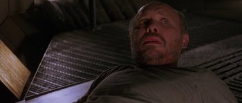 Movie still from “Leviathan” (1989), directed by George P. Cosmatos – A person looking up at the ceiling; Close Up shot, Low angle