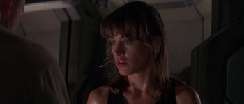 Movie still from “Leviathan” (1989), directed by George P. Cosmatos – A person wearing a black shirt; Close Up shot, Over the shoulder angle