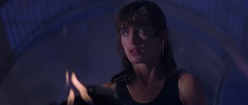 Movie still from “Leviathan” (1989), directed by George P. Cosmatos – A person holding something in their hand; Close Up shot, Over the shoulder angle