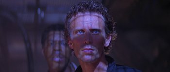 Movie still from “Leviathan” (1989), directed by George P. Cosmatos – A person wearing a black shirt; Close Up shot, Low angle