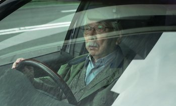Movie still from “Like Someone in Love” (2012), directed by Abbas Kiarostami – An older man sitting in the driver's seat of a car; Close Up shot, Low angle