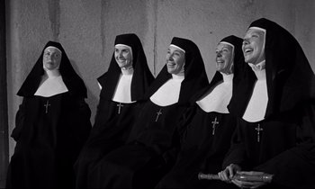 Movie still from “Lilies of the Field” (1963), directed by Ralph Nelson – A group of nuns sitting next to each other; Medium shot, High angle