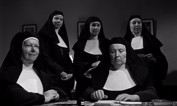 Movie still from “Lilies of the Field” (1963), directed by Ralph Nelson – A group of women dressed in nun's clothes; Medium shot, Low angle