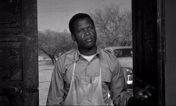 Movie still from “Lilies of the Field” (1963), directed by Ralph Nelson – A black and white photo of a man in an apron; Close Up shot, Low angle