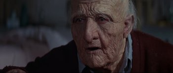 Movie still from “Little Big Man” (1970), directed by Arthur Penn – An old man with wrinkled skin looking at the camera; Close Up shot, Low angle