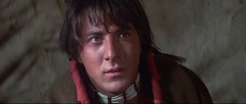 Movie still from “Little Big Man” (1970), directed by Arthur Penn – A person wearing a necklace; Close Up shot, Low angle